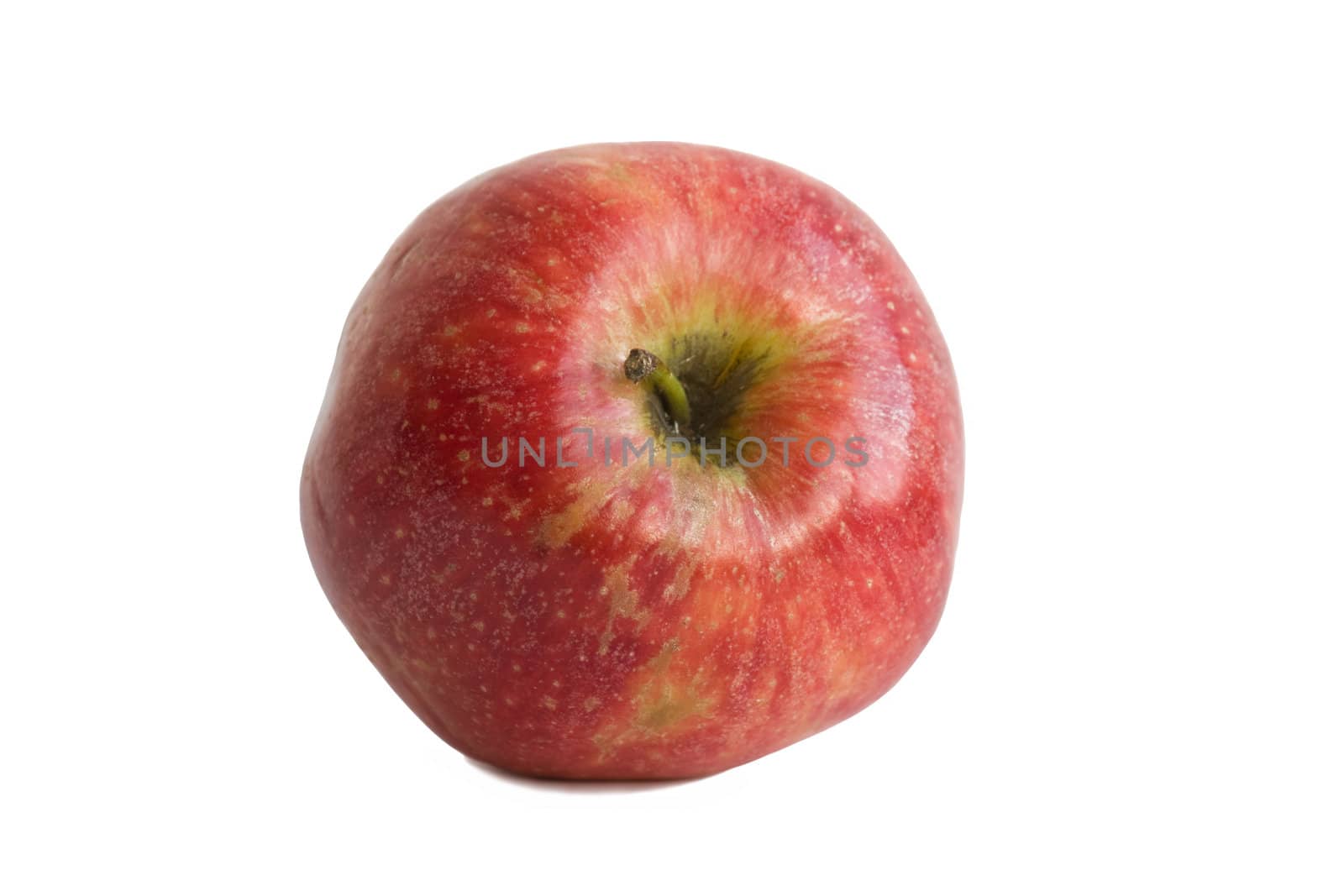 The beautiful red apple is isolated on a white background.
