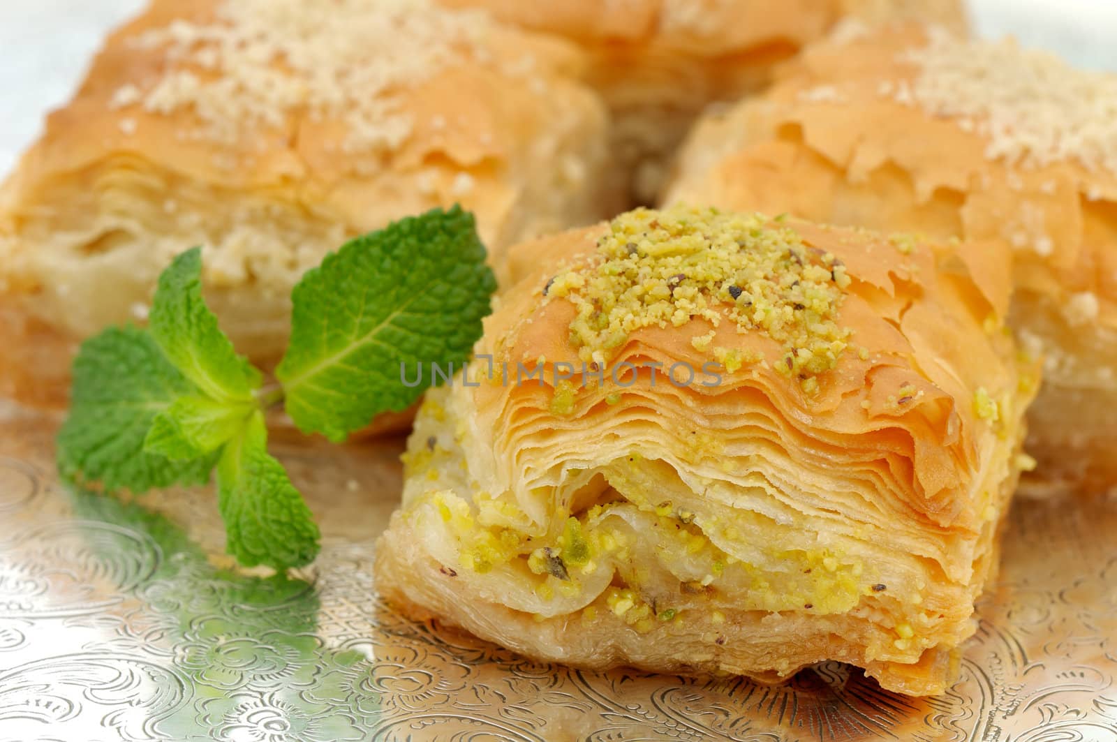 Fresh baklava served on a typical Moroccan tray