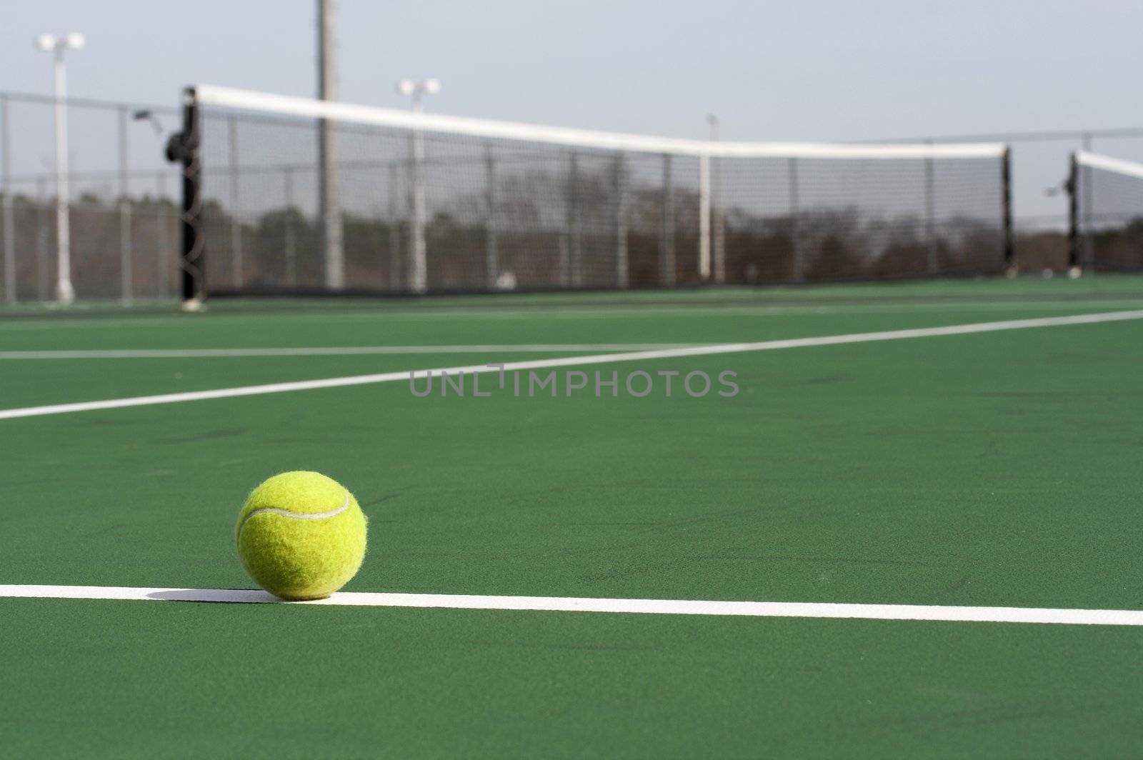 a picture of a tennis ball on the court