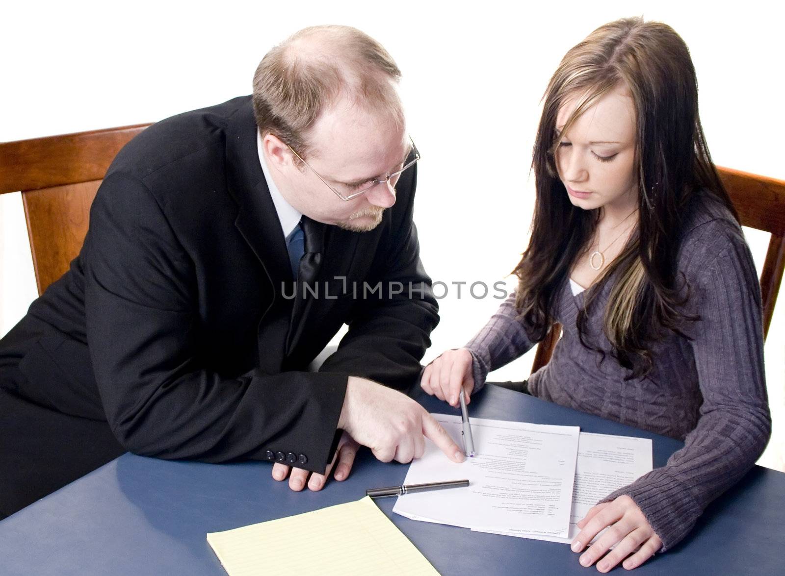 Business Man looking over document with client