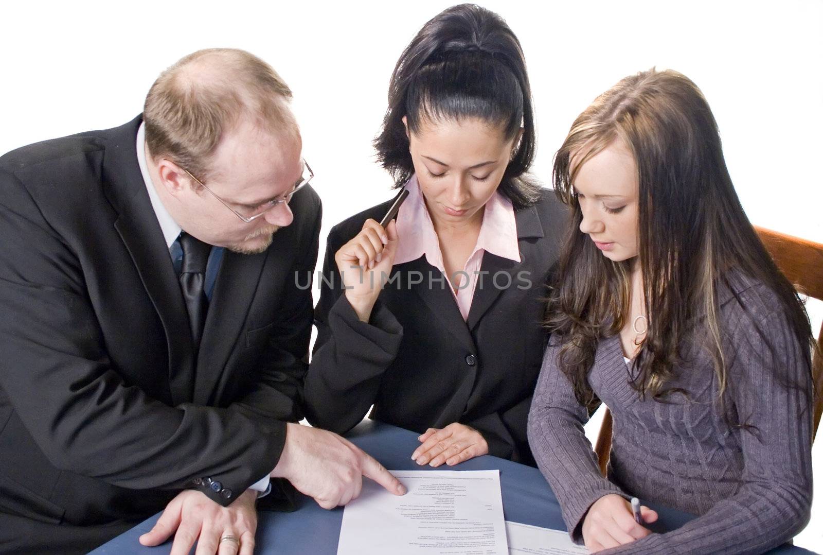 Team of young proffesionals reviewing document