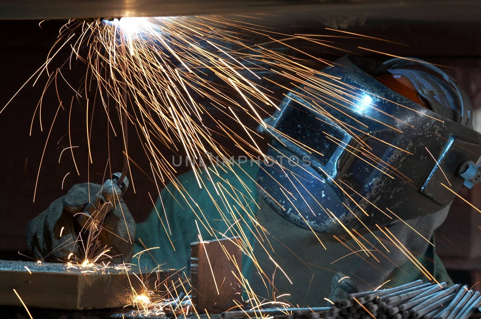 a welder working at shipyard during night shift