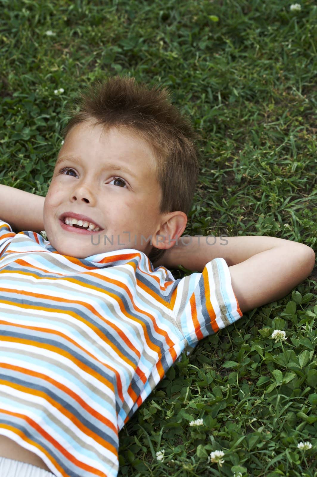 young boy in grass 