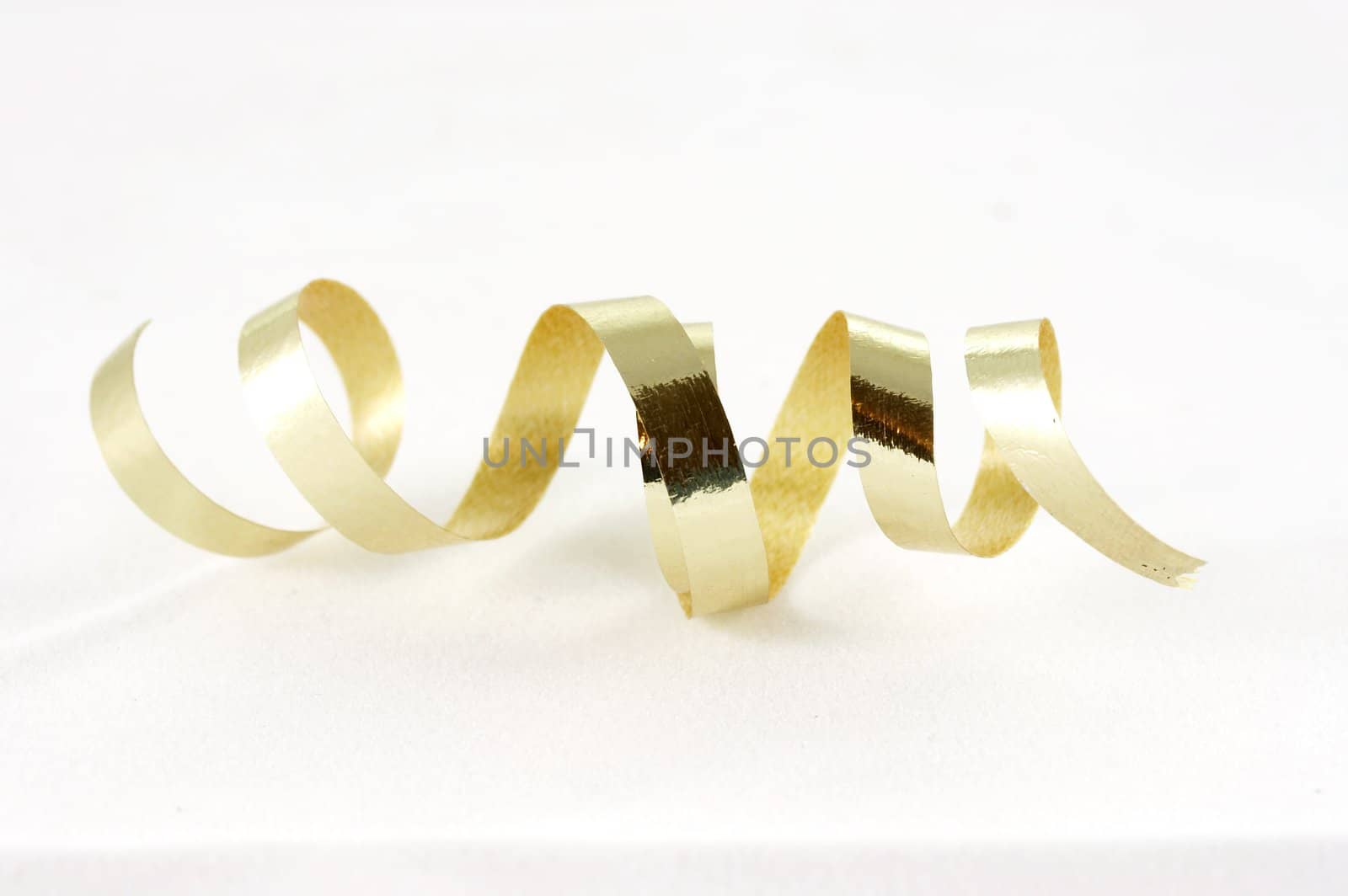 a macro photograph of gold ribbon