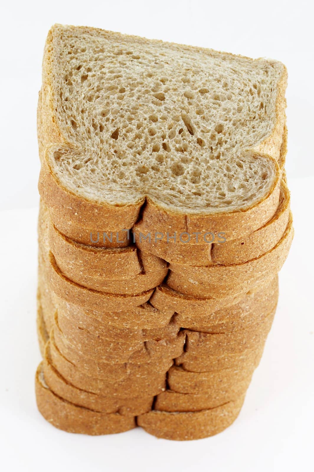 a close up macro of stacked wheat bread
