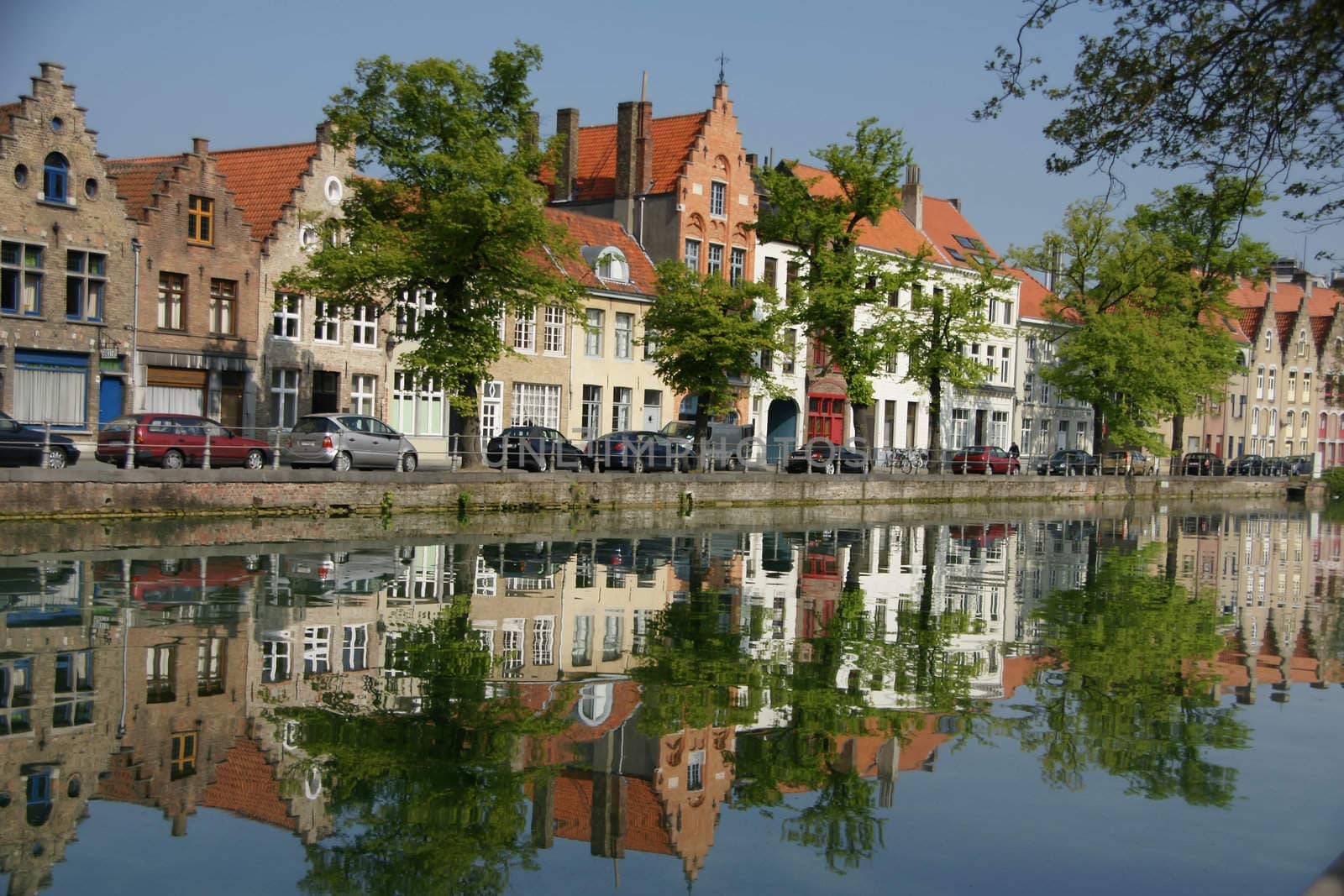 Canal with reflection of houses