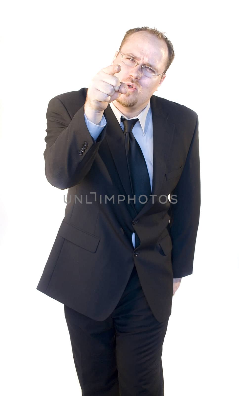 angry businessman pointing isolated on white