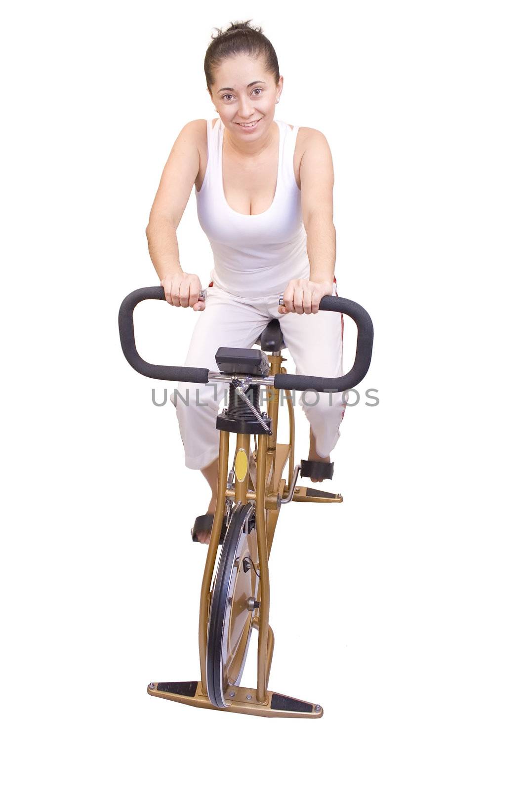 Young woman on exercise bike