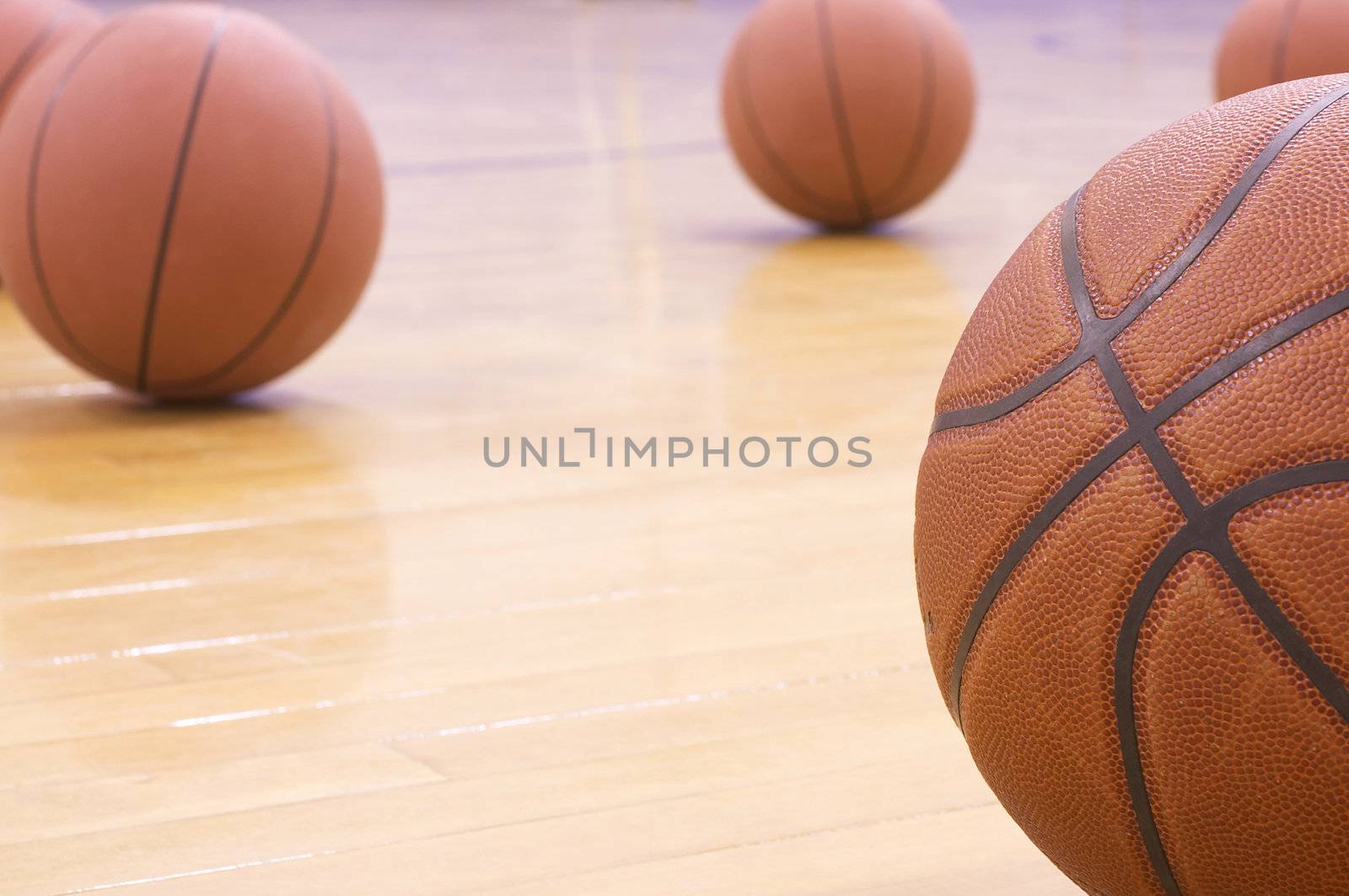 basketballs on gym floor