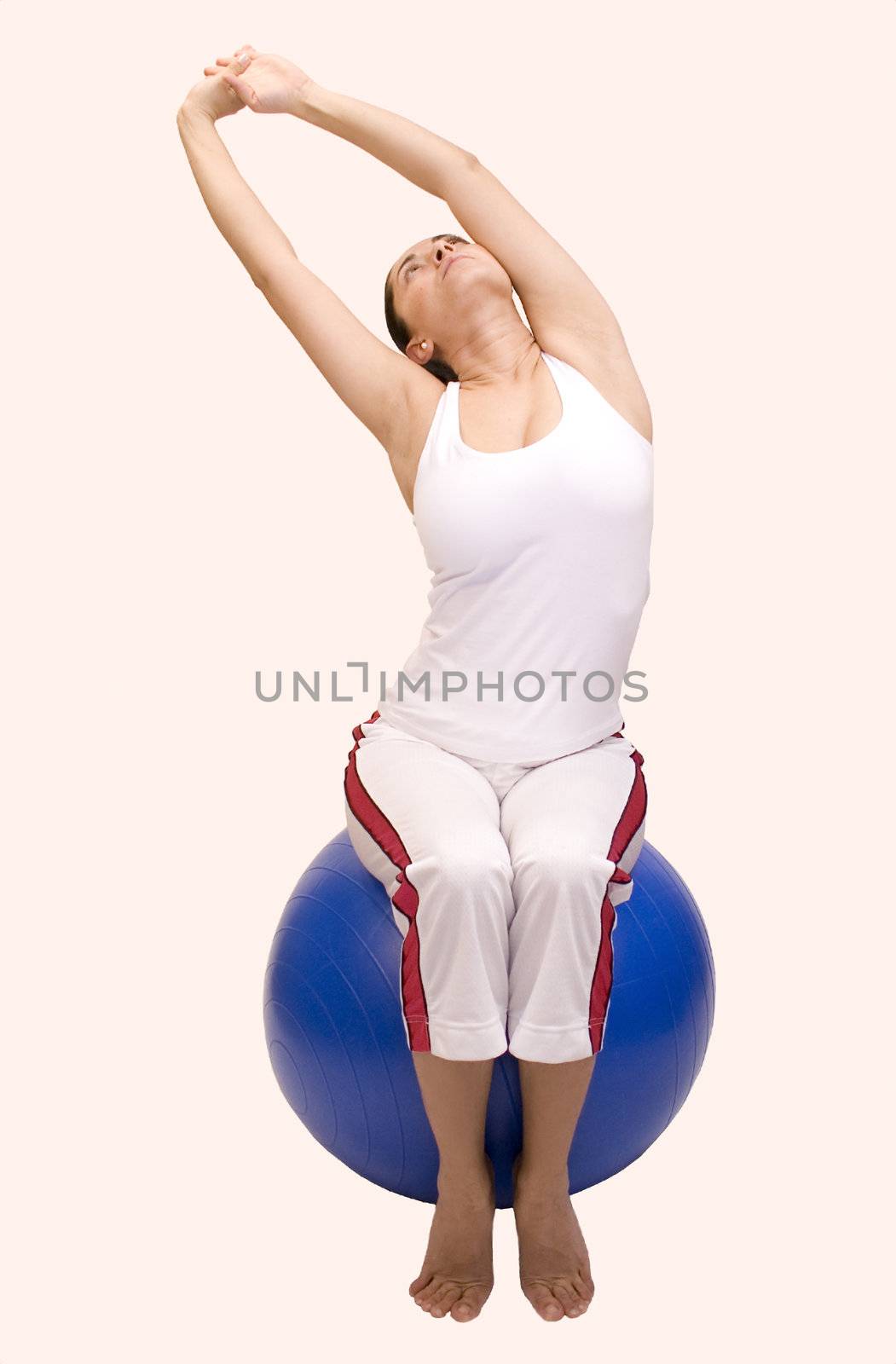 Woman doing stretches on pilates ball