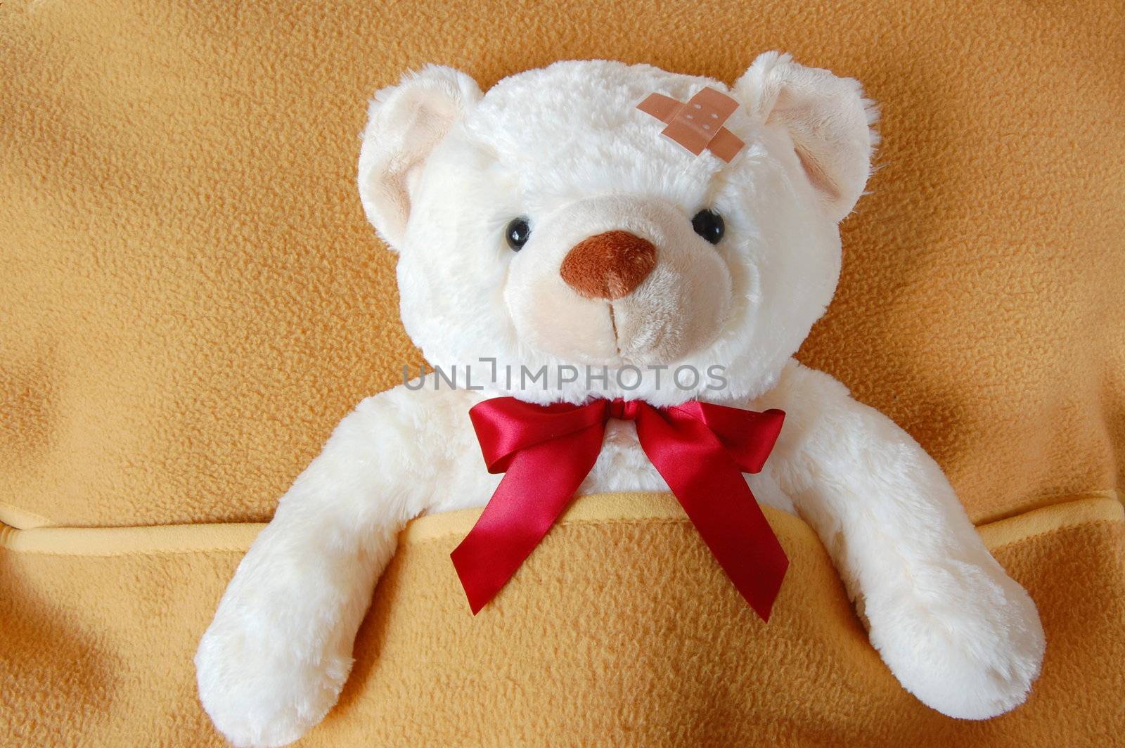 ill teddy bear in bed waiting for medicine