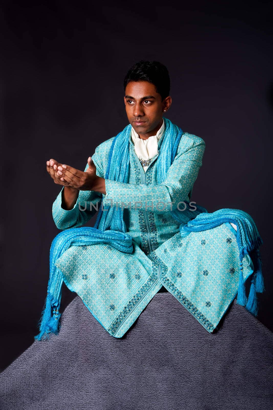 Hindu man sitting in lotus position by phakimata