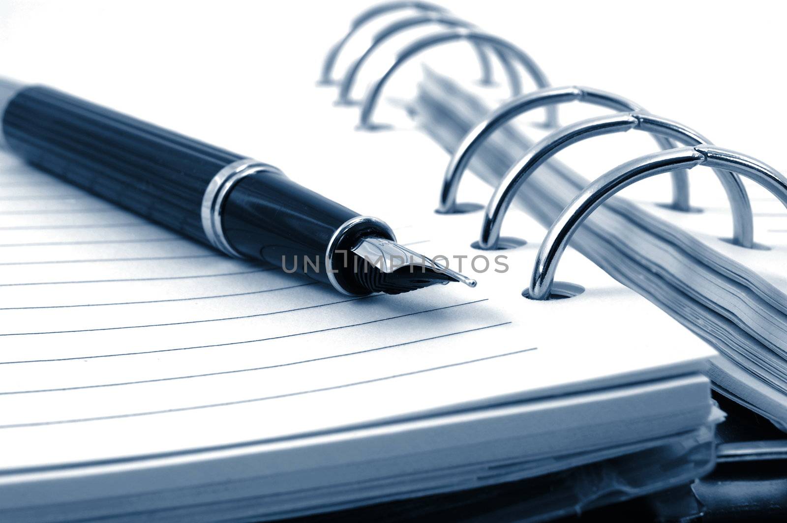 business pocket planner and pen ready to note an appointment