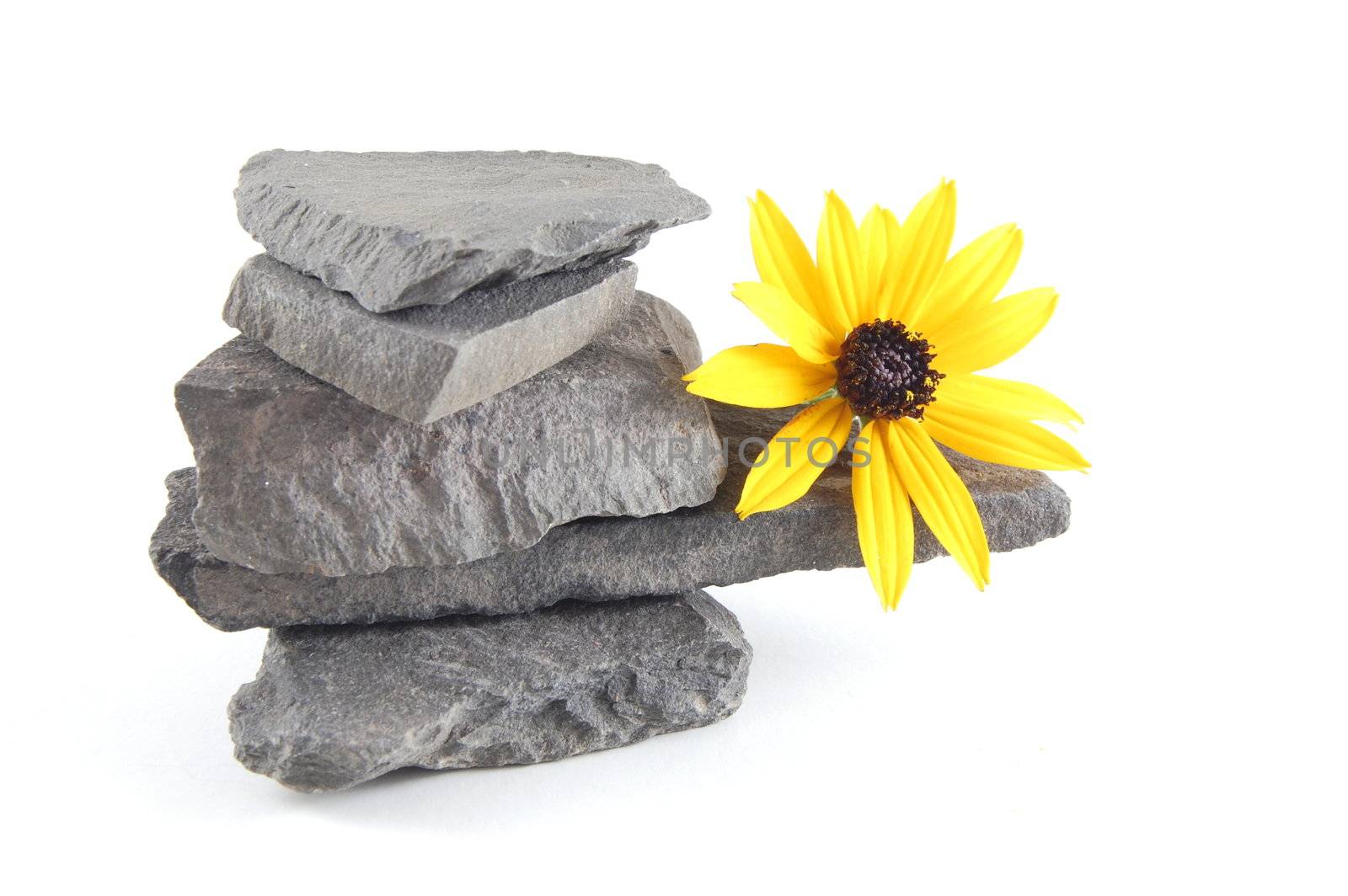 A tower made of stones isolated on a white background.