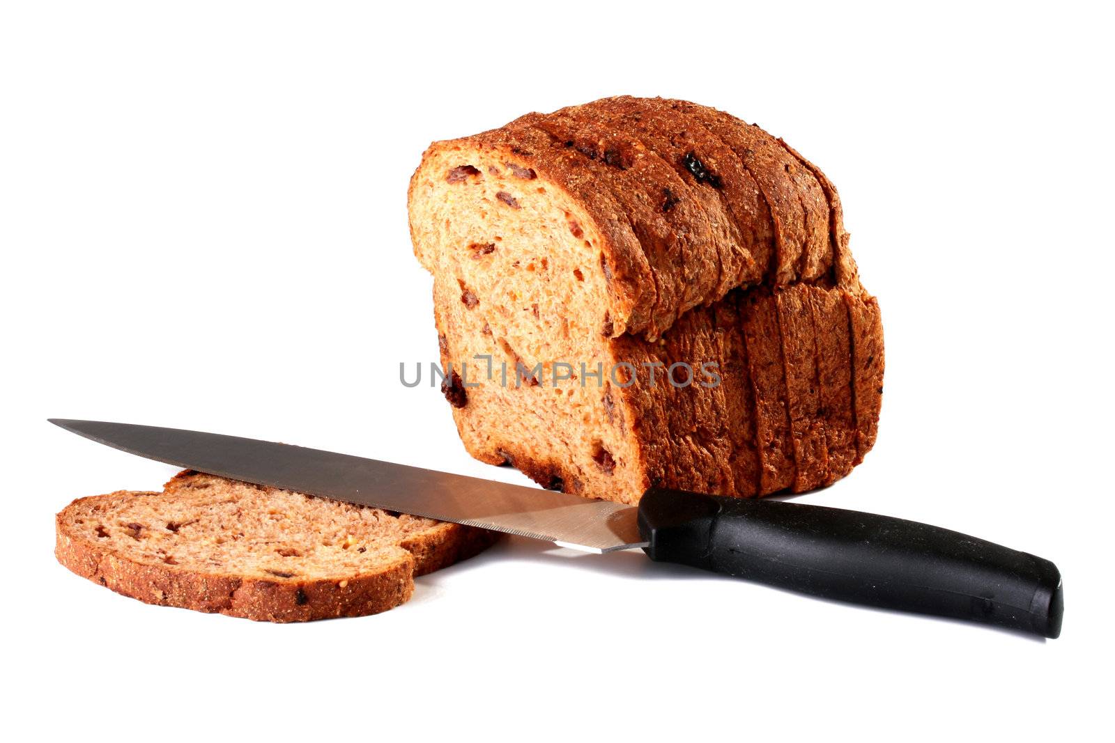 Slice of the cut off bread with raisin on a white background.