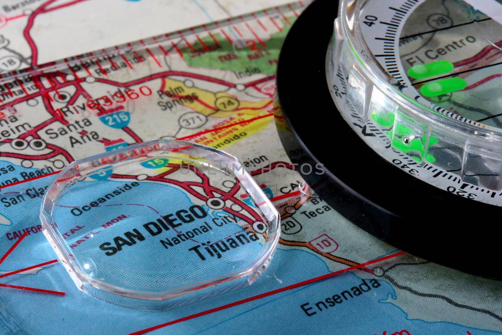 USA map with the city of San Diego and a compass with magnifying glass over San Diego.