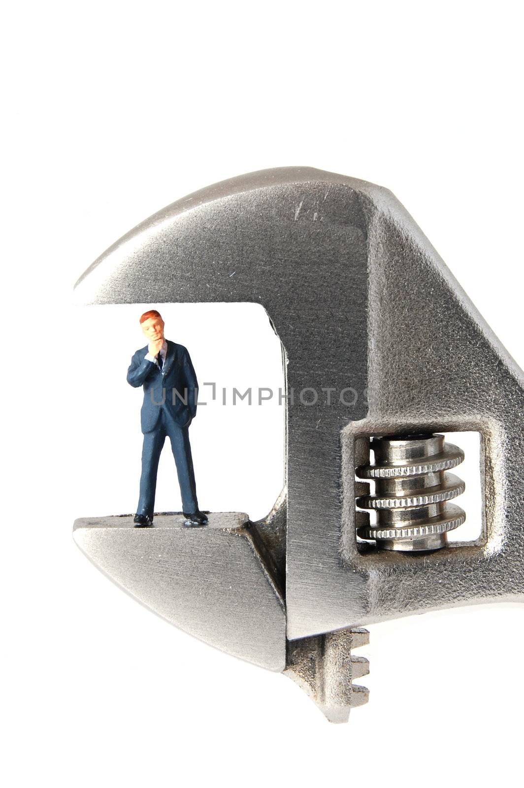 tiny business man with caliper showing concept for stress at work