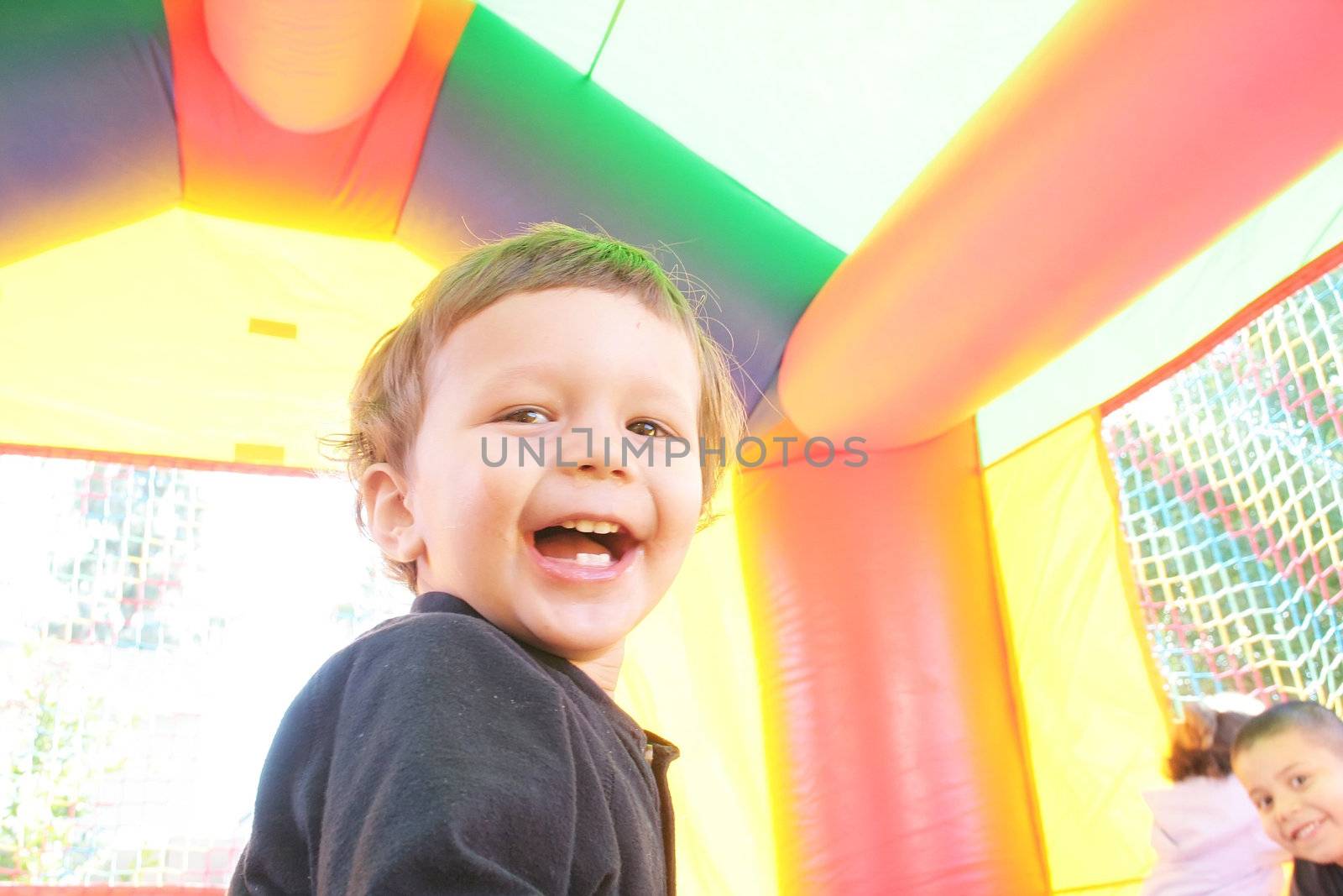 kids playing in inflatable air castle