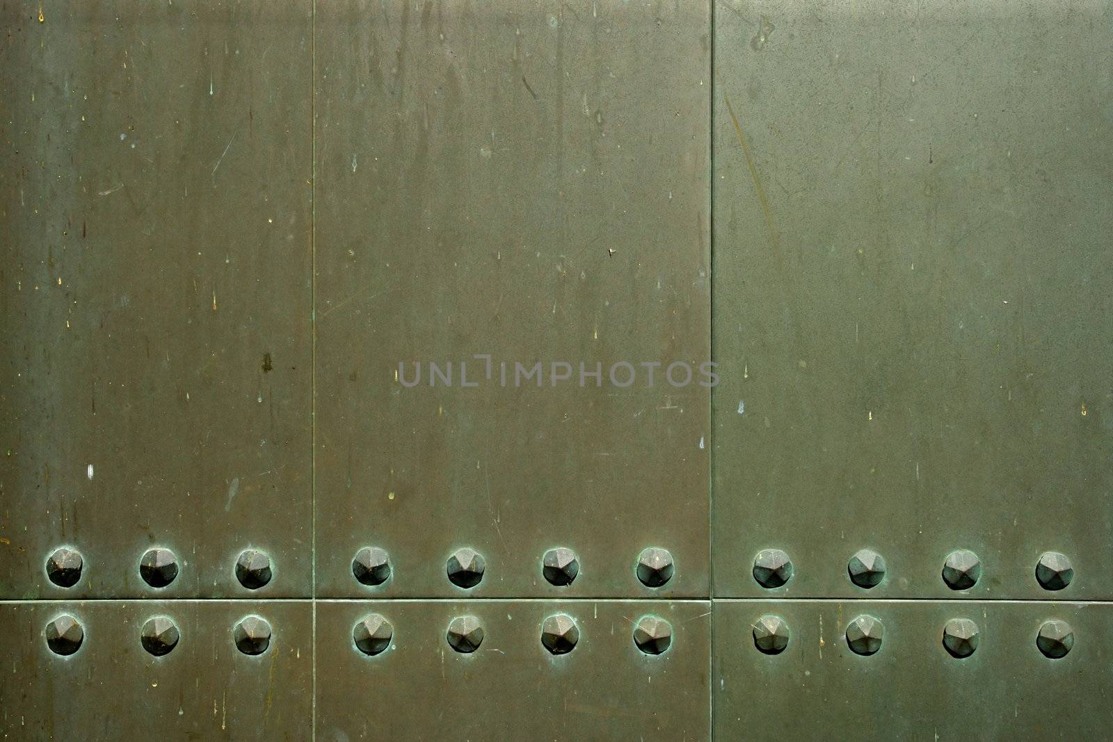Background/industrial image of metal plates with old rivets.

