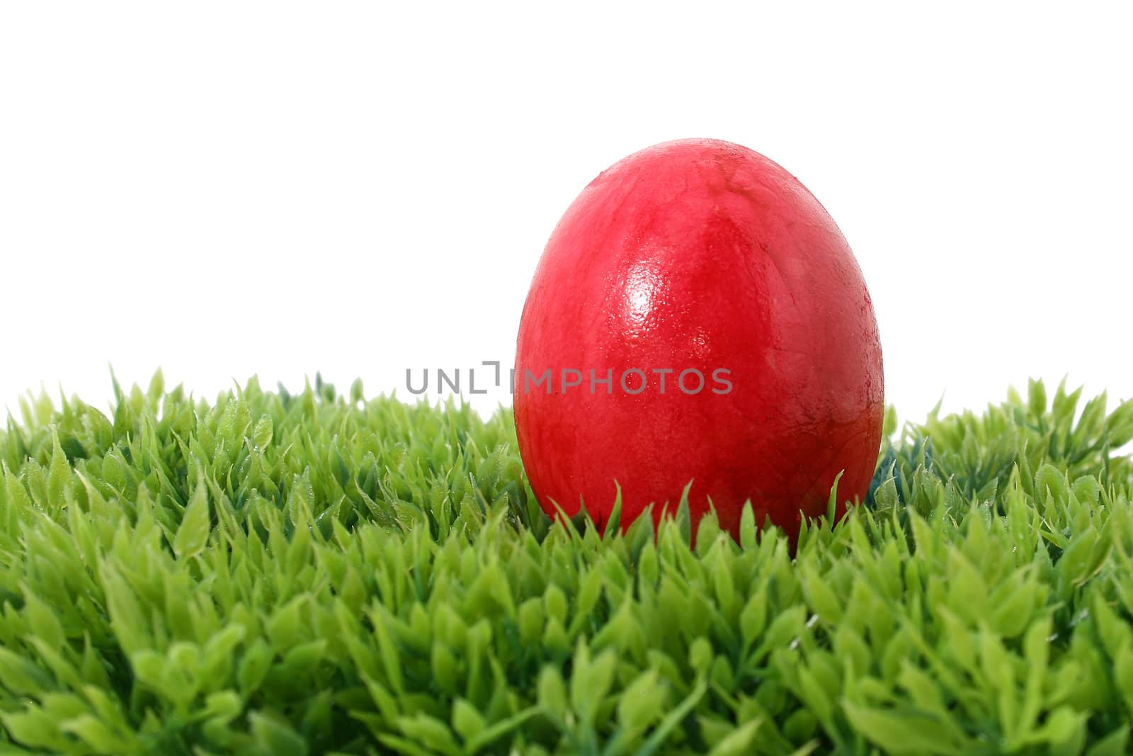 red easter egg on grass by Brightdawn