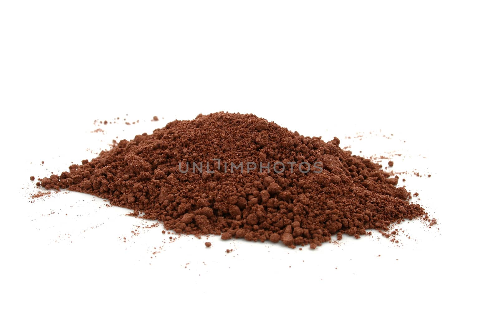 a pile of cocoa powder on white background