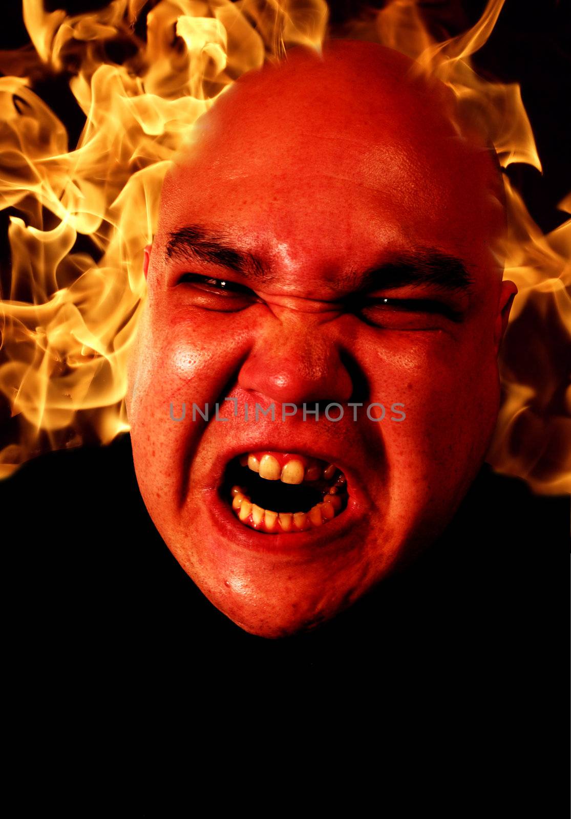 Image of fire and a demonic man.  Two files merged together and enhanced. Flame image is from my portfolio.  Sure, it's overfiltered - but in a good way. Anger management and all that stuff...
