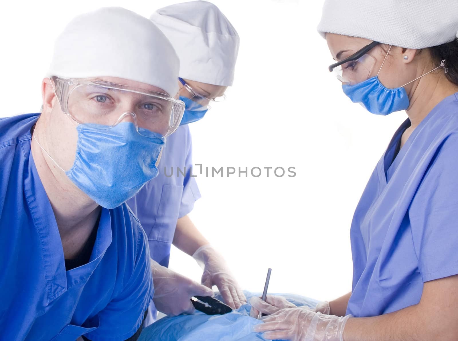 Doctors performing surgery on white