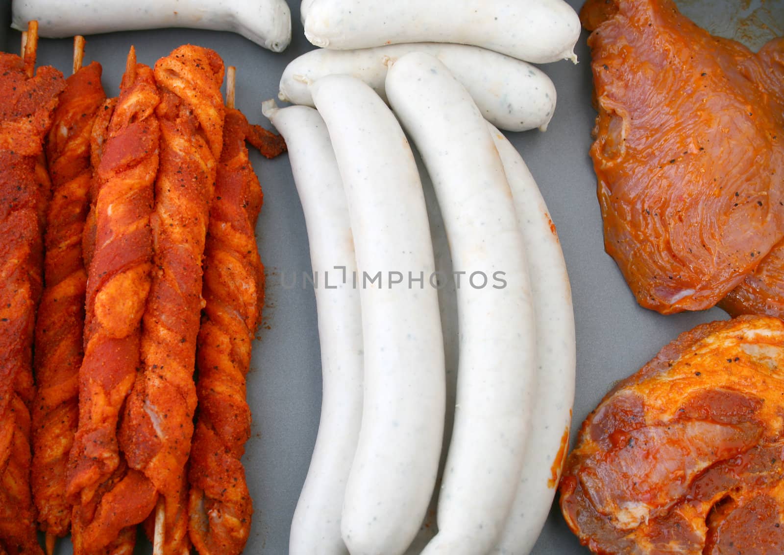 raw barbecue meat and sausages