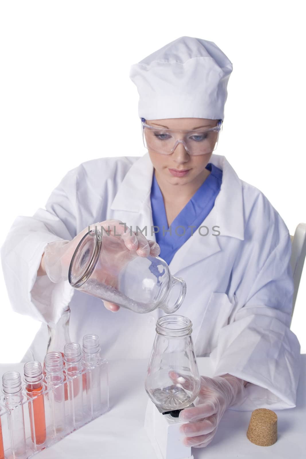 Young scientist in laboratory with test tubes and chemicals