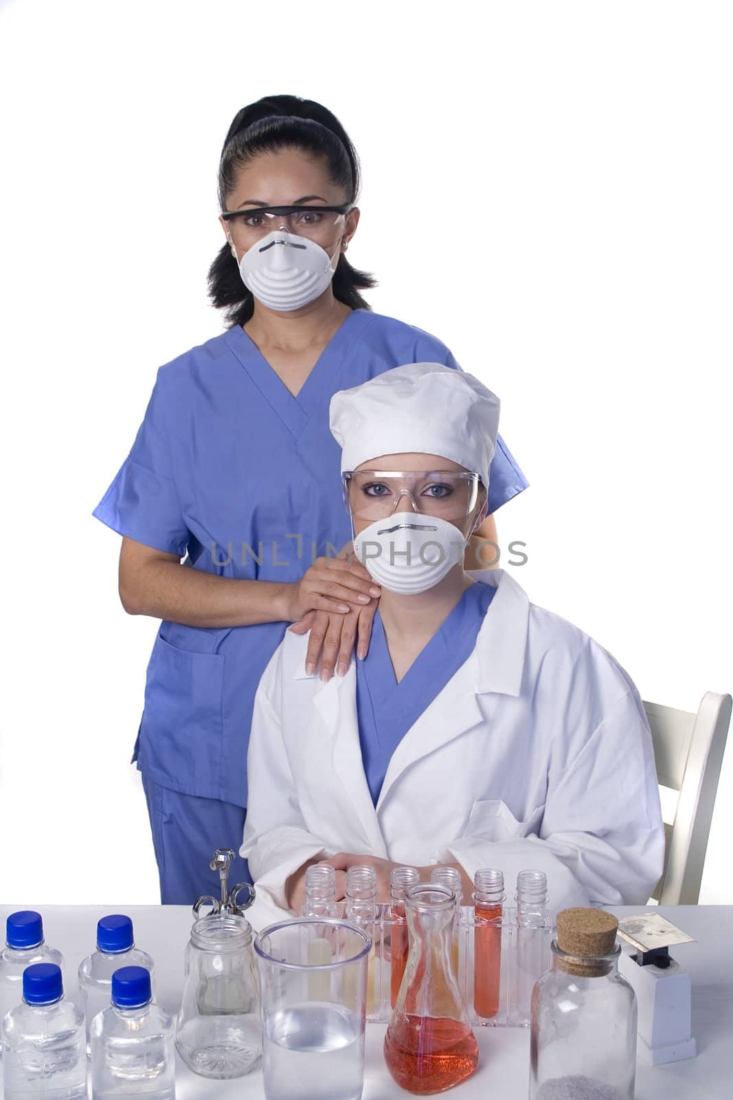 Young scientist in laboratory with test tubes and chemicals