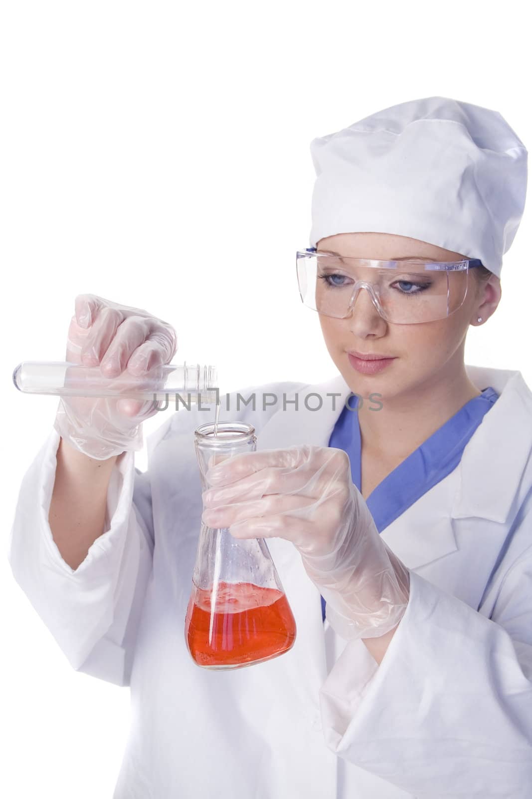 Young scientist in laboratory with test tubes and chemicals