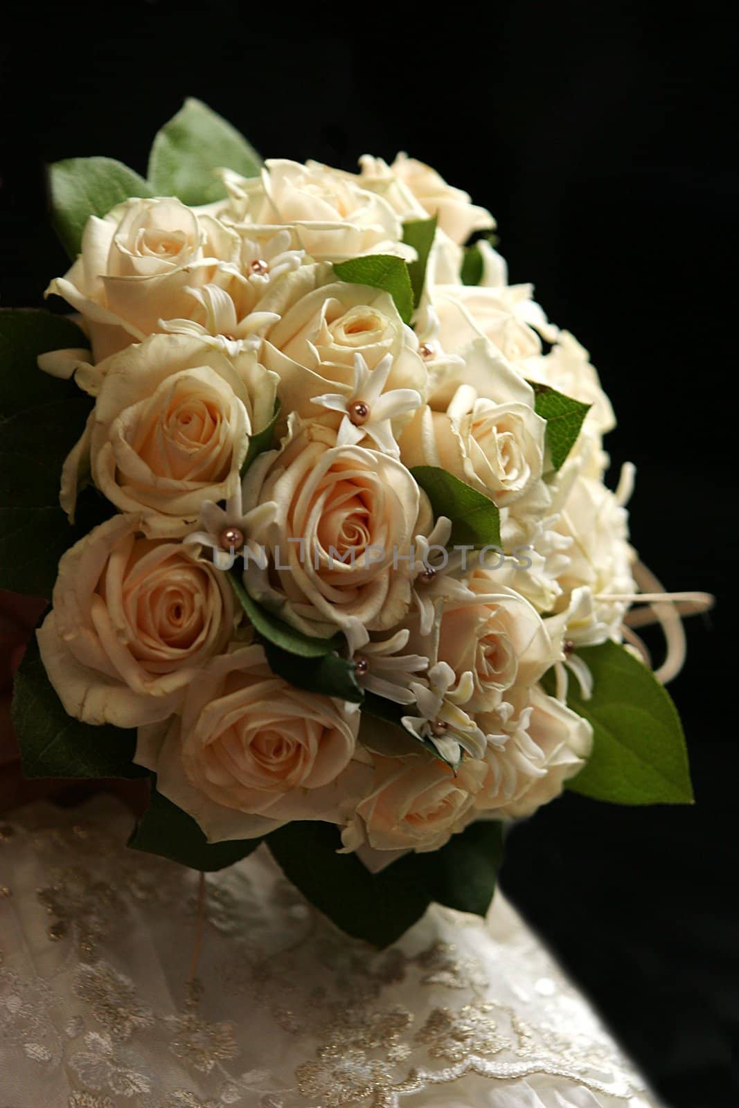 The bride holds a wedding bouquet