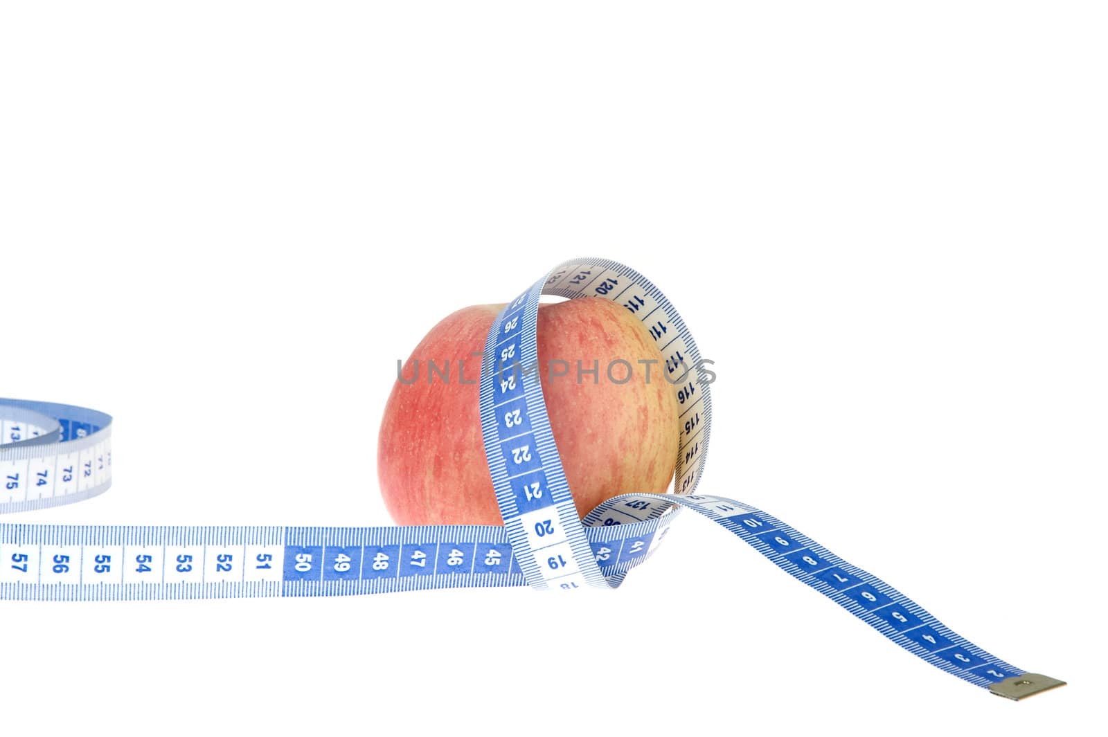 closeup of an apple with a  centimeter on white background