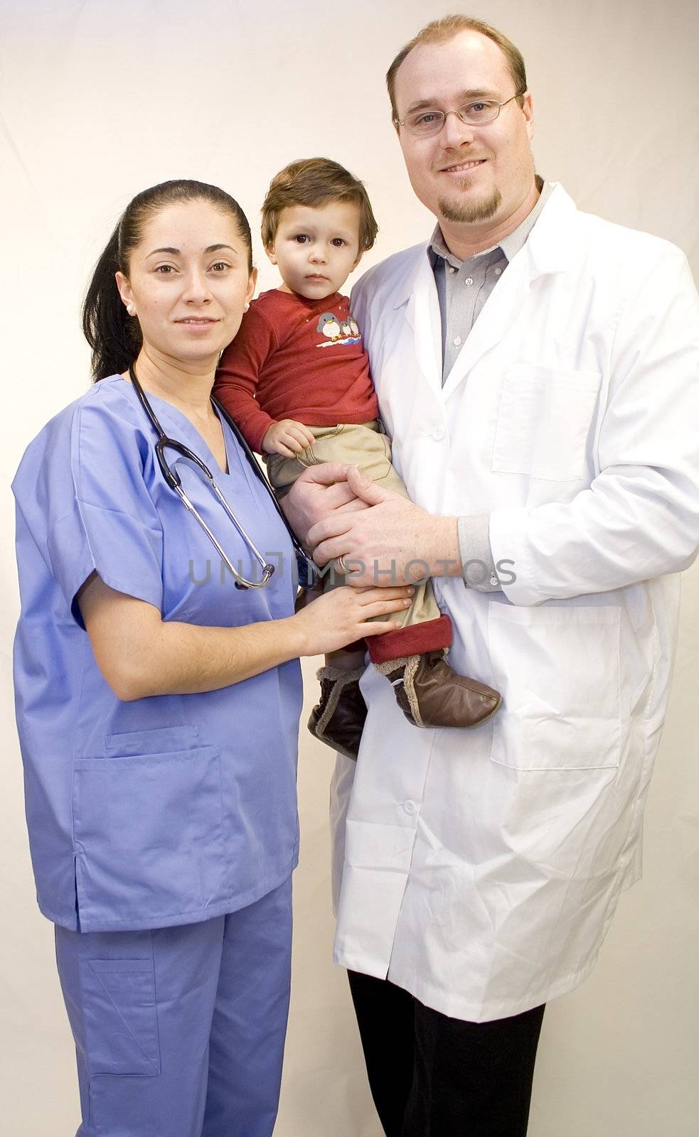 Nurse, Baby Boy, and Doctor together isolated on white