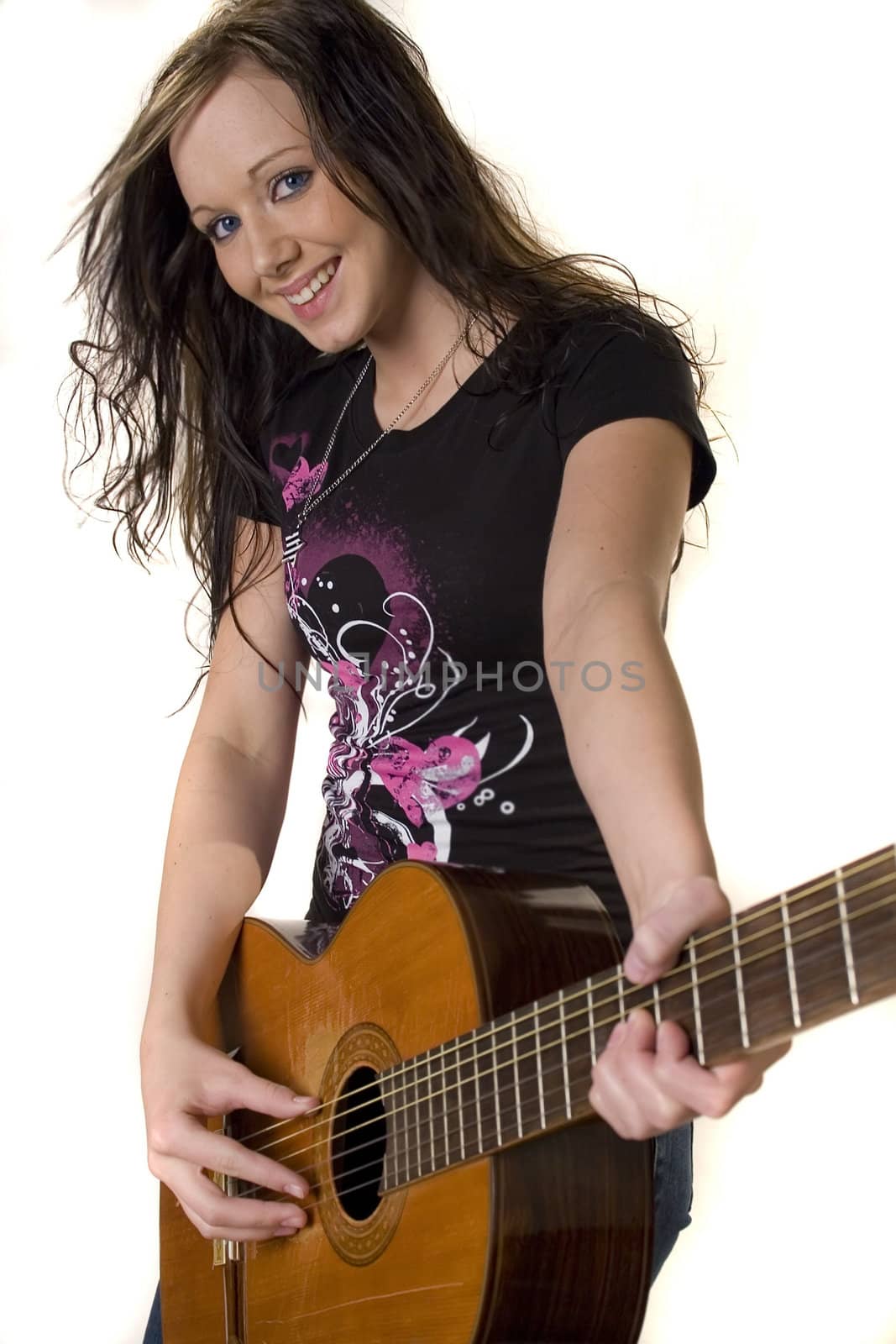 Pretty young rocker girl with guitar