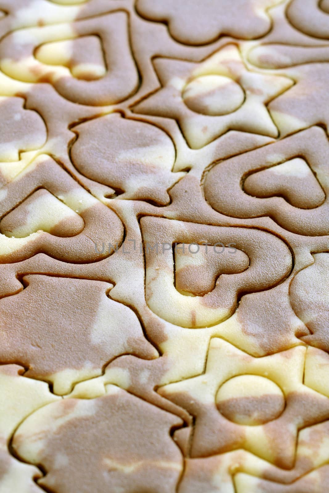 Various figures on a chocolate dough, food background