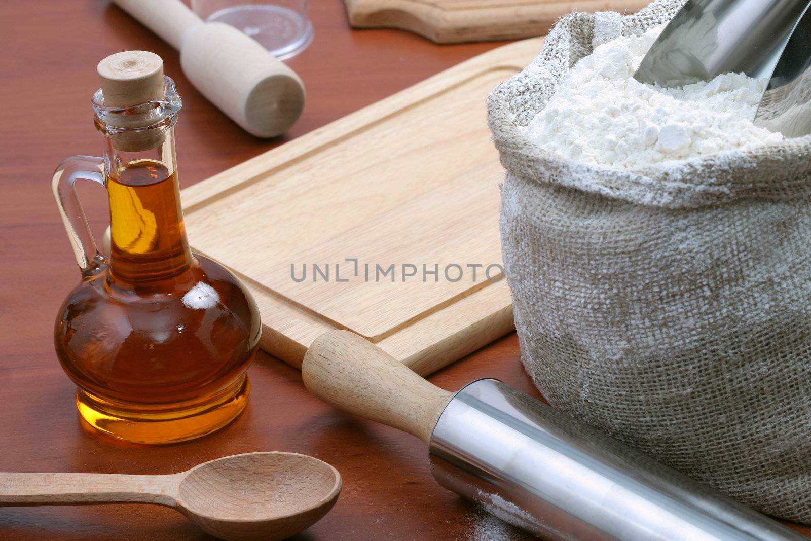 Vegetable oil and kitchen tools, background