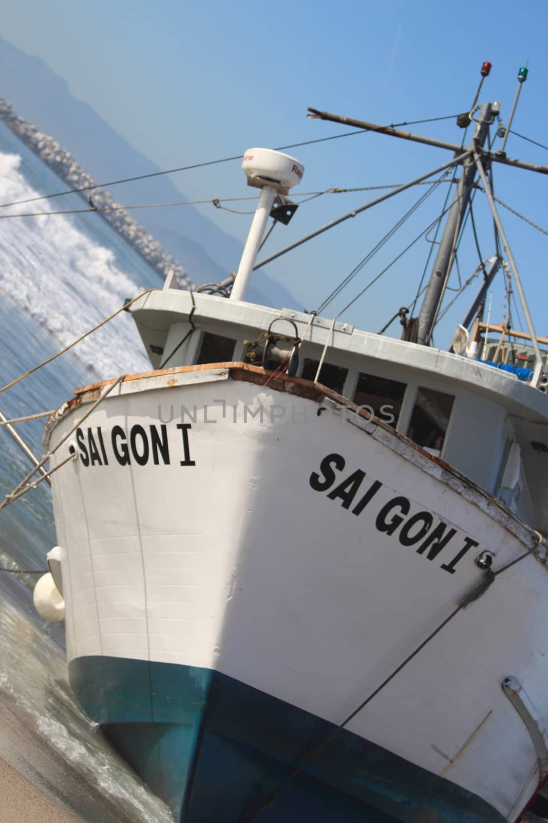 VENTURA, CA, USA - January 8, 2010 - The fishing boat SAI GON I ran aground after 4 people were rescued early morning. The rescue team tried to free the boat throughout the day January 8, 2010 in Ventura, CA