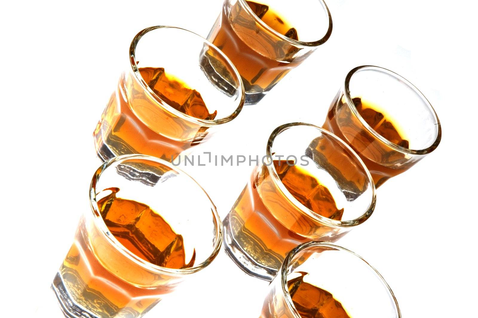 Whisky in glass isolated over white background