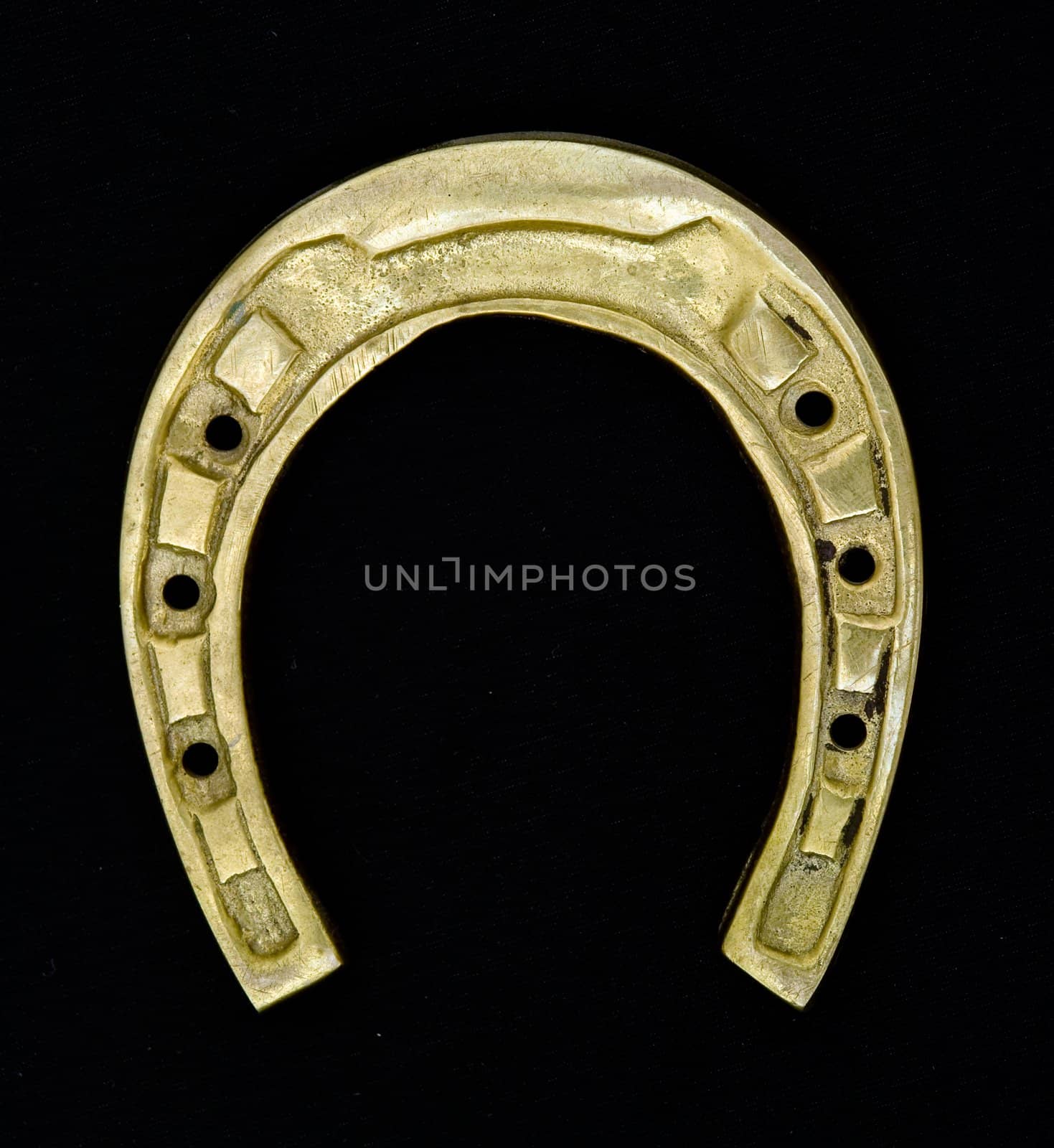 Amulet. Horseshoe on a black background