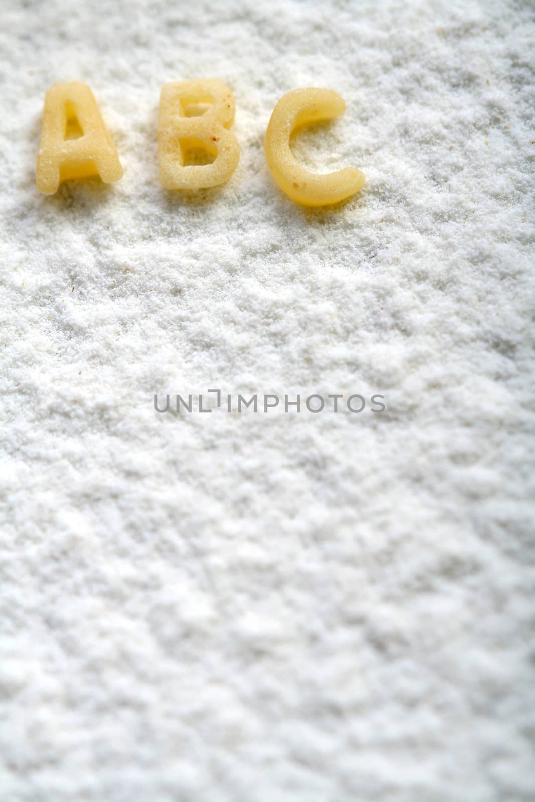 Eatable alphabet on flour, education by parrus