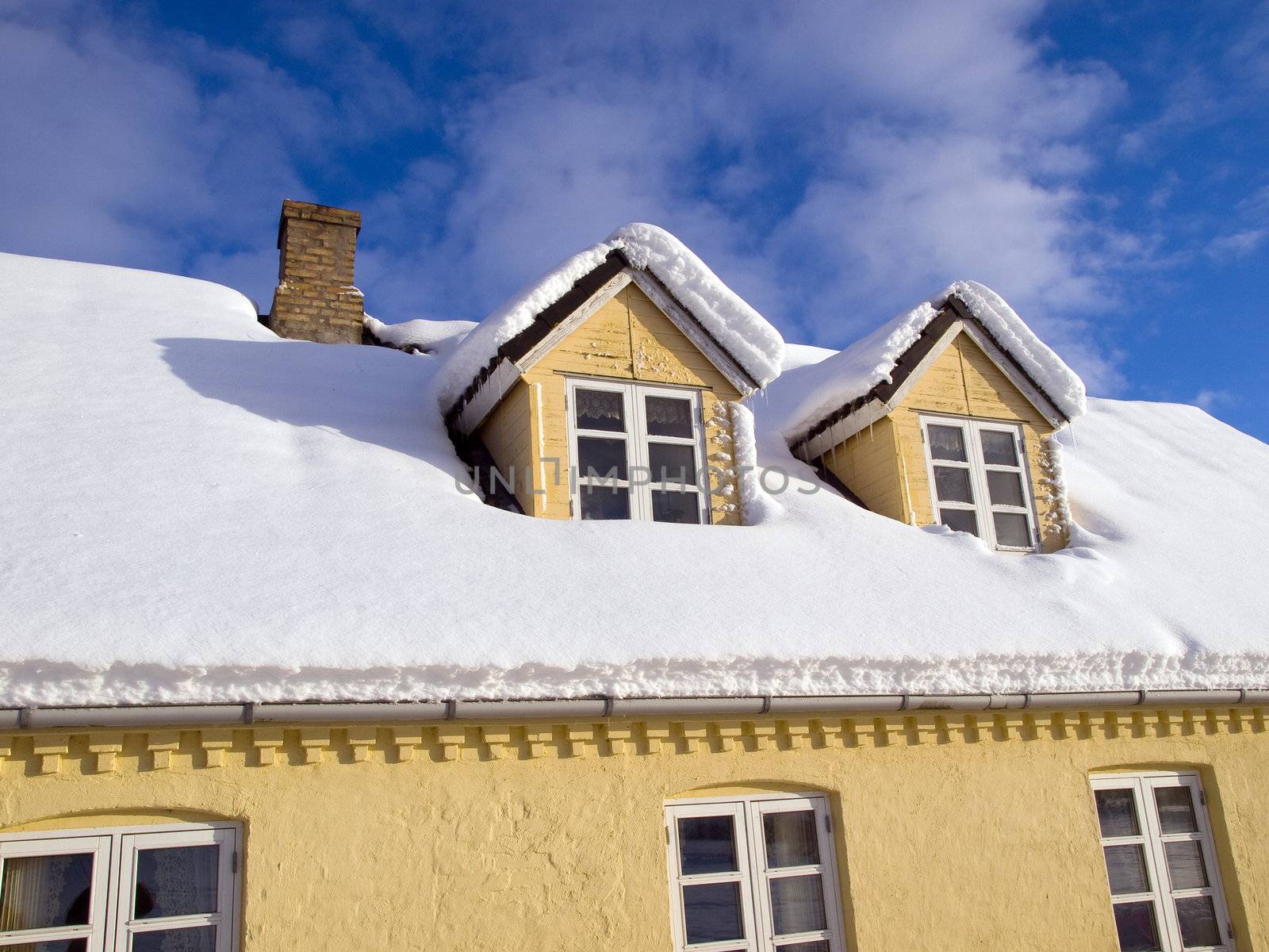 Roof of a country house covered with snow perfect winter background 