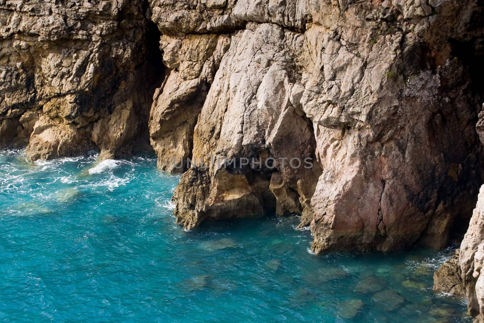Water at the base of a rocky cliff.  Cape Saint Vincent, Sagres, Portugal