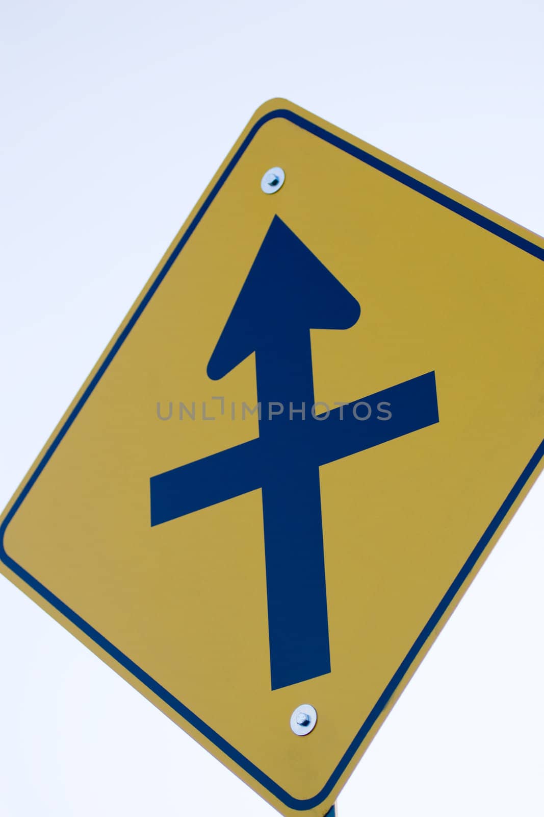 A closeup of a 'crossing ahead' road sign.