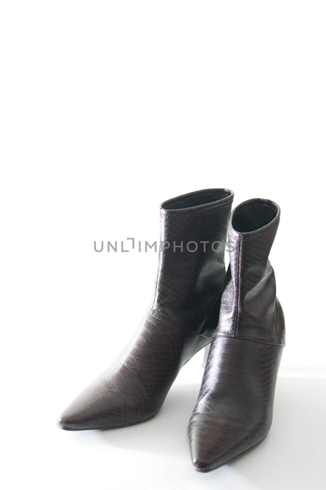 Womans boots, isolated on white by woodygraphs