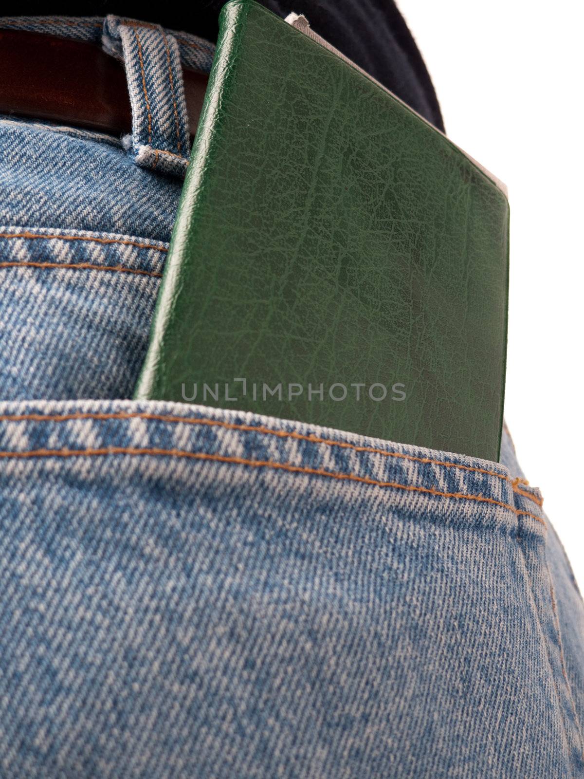 A closeup of a cheque book in the back pocket of blue jeans, isolated on white.