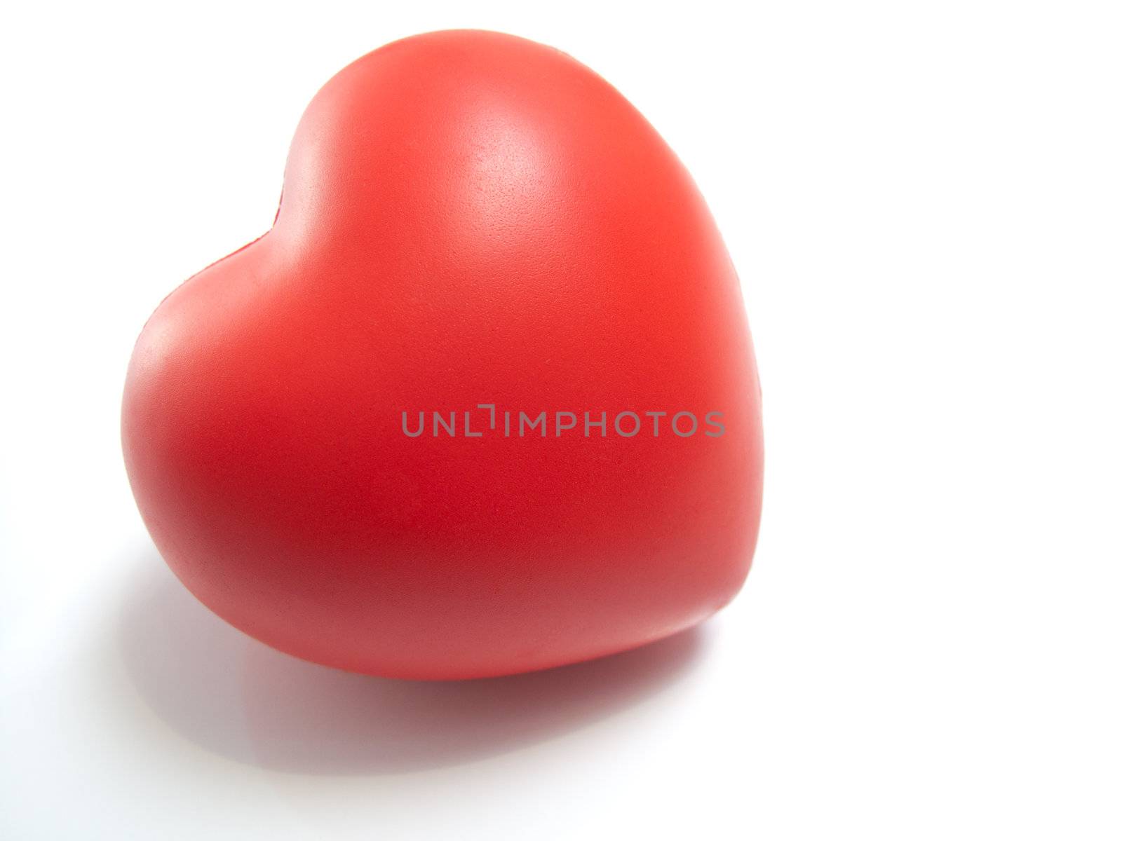 A red valentines day heart, isolated on white.