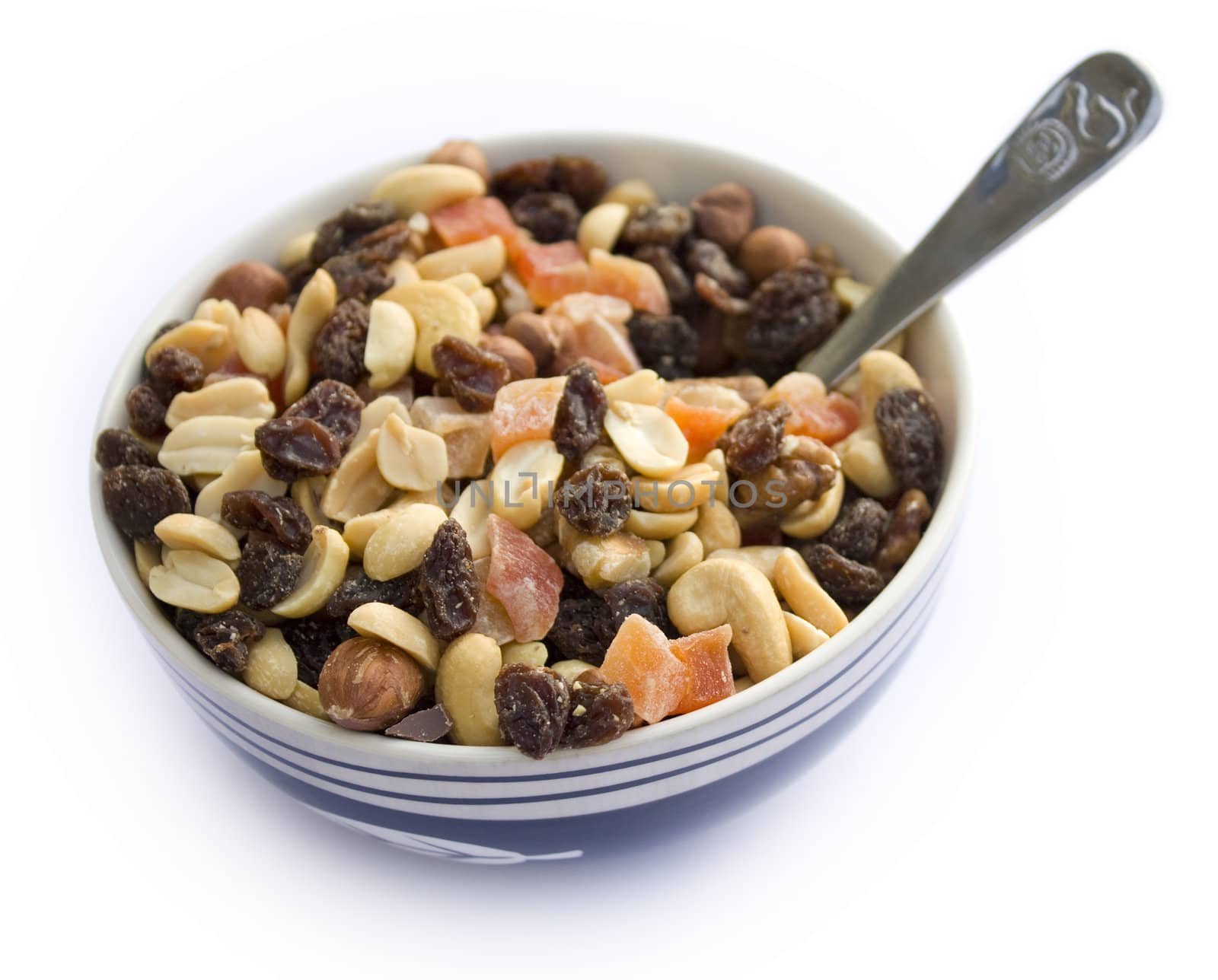 Breakfast bowl filled with healthy fruits and nuts. On white background.