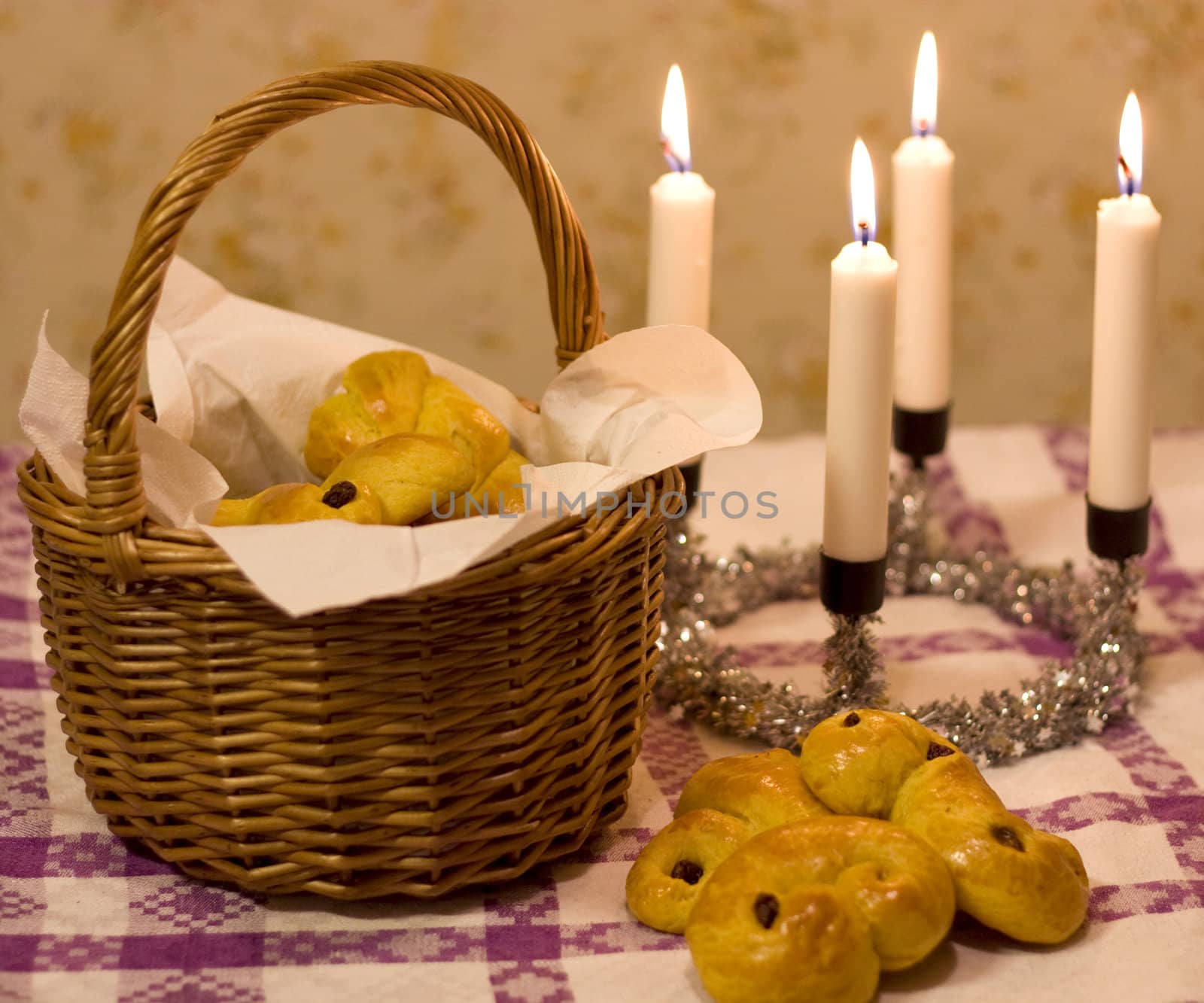 Sweet saffron buns (lussekatter) in a basket, ready for st. Lucia's day.