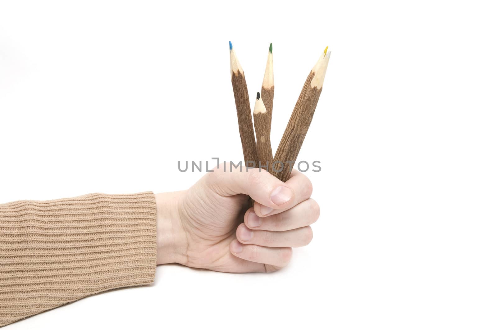 Man's hand with many color pencils on wite background